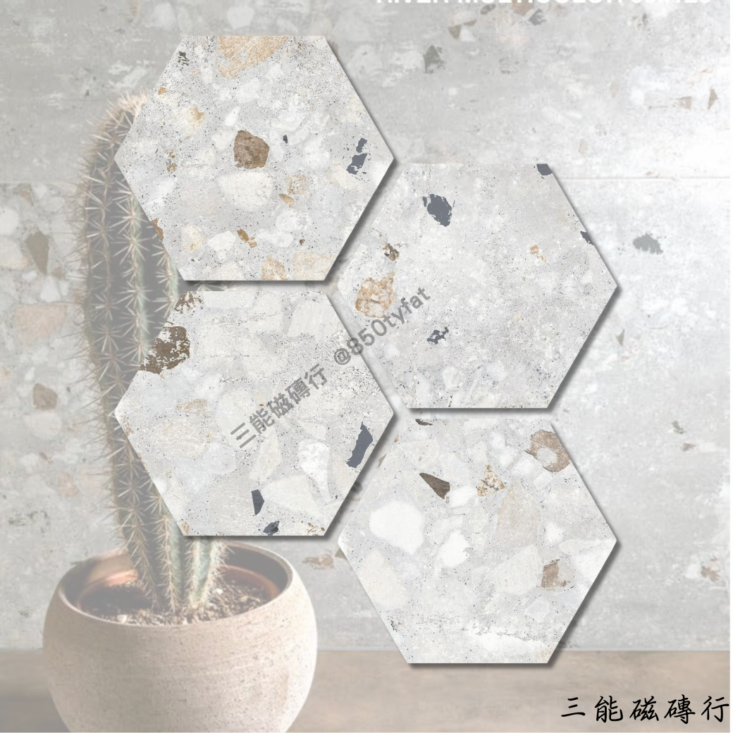 六角形瓷磚，純白色基底，帶有細緻的顆粒與水泥質感，營造簡約自然的氛圍，適用於現代風格的牆面與地坪鋪