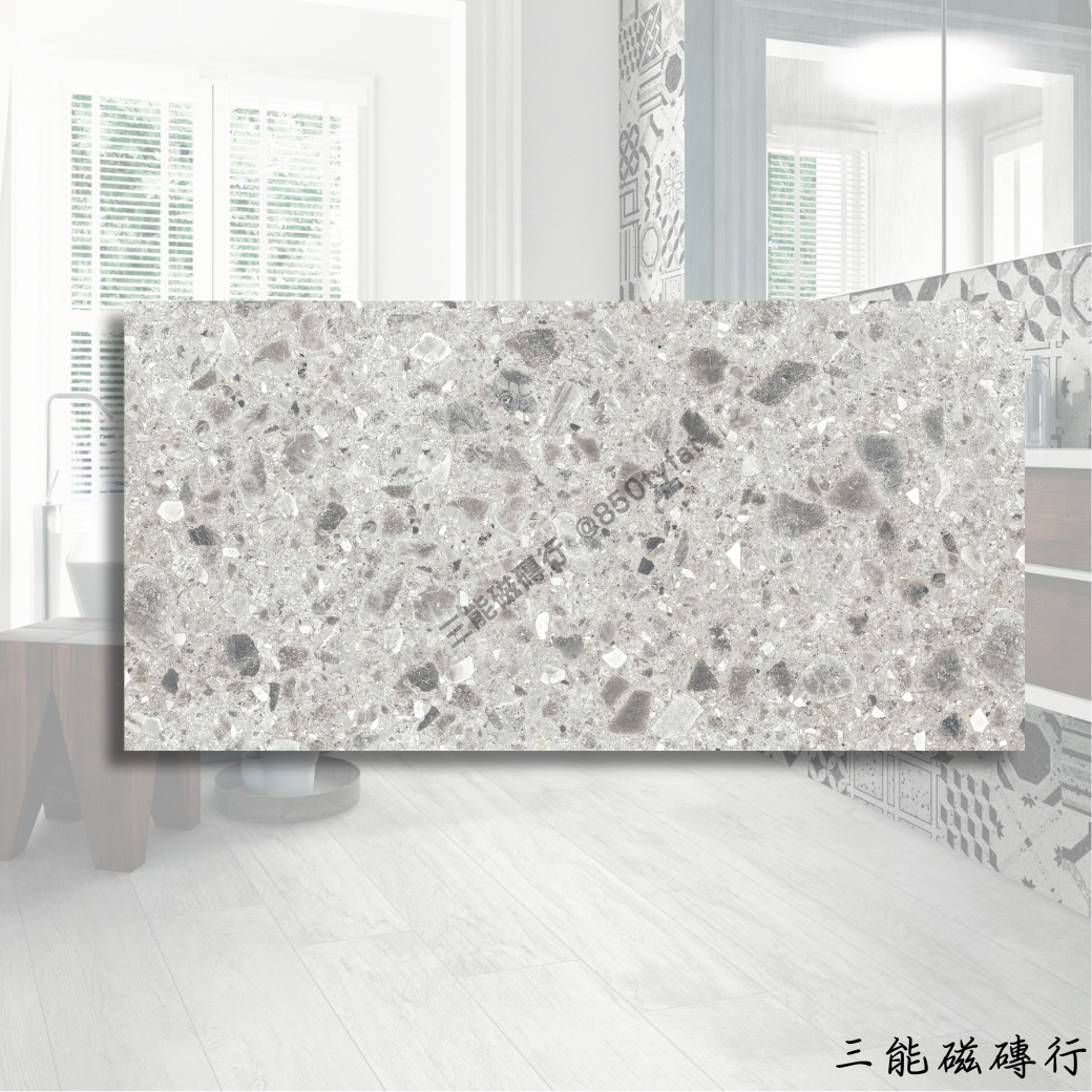 布雷西亞深灰色磁磚，60x120cm，深沉灰底佐以晶礦般碎石點綴，展現都會質感。