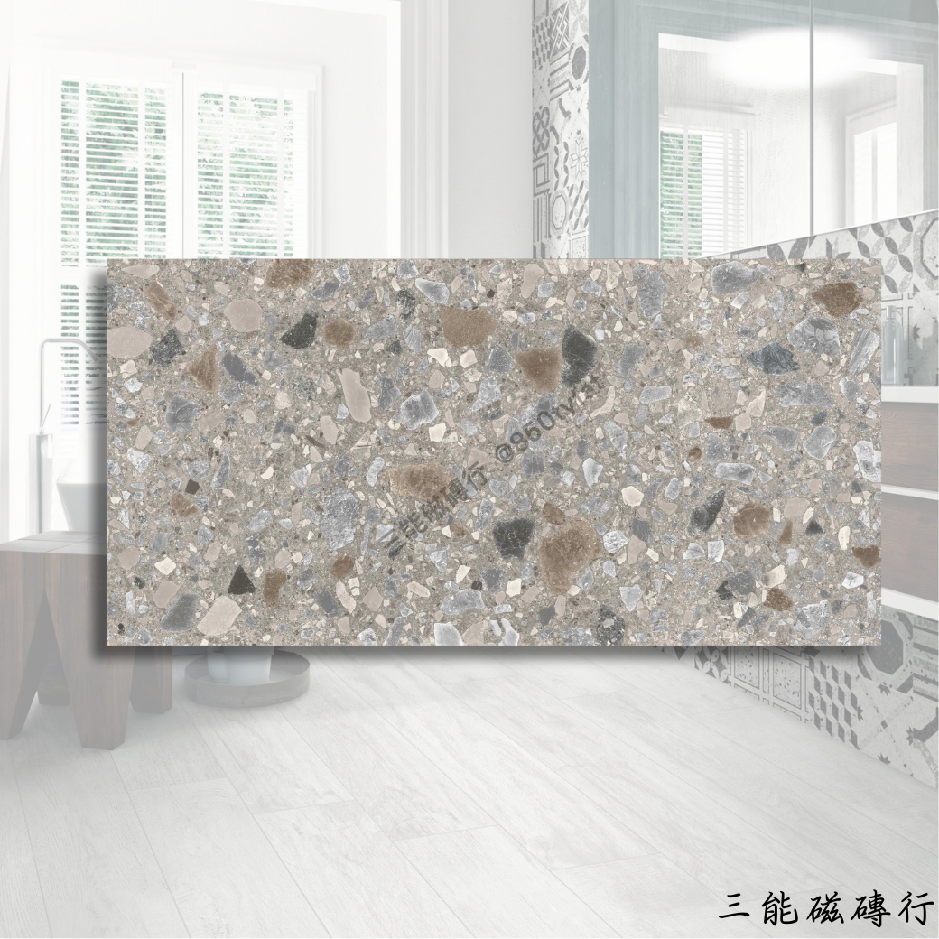 布雷西亞深灰色磁磚，60x120cm，深沉灰底佐以晶礦般碎石點綴，展現都會質感。